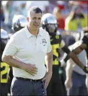  ?? Associated Press ?? OFFSEASON Oregon head coach Mario Cristobal watches during warm ups before the Rose Bowl football game against Wisconsin in Pasadenaon Jan. 1, 2020. The National Signing Day period begins Wednesday.