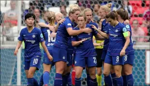  ?? Cipriani
AP Photo/Laurent ?? In this file photo dated 2019, Chelsea’s Erin Cuthbert (center) and teammates celebrate scoring against Lyon during their Women’s Champions League soccer match in Decines, France.