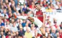  ?? MICHAEL REGAN/GETTY IMAGES ?? Arsenal’s Pierre-Emerick Aubameyang controls the ball during a game against Manchester City at Emirates Stadium on Sunday.