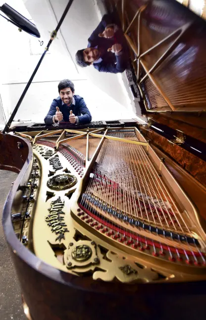  ?? PHOTO: PETER MCINTOSH ?? Gritty determinat­ion . . . Alexander Pianos owner and repairer Adrian Mann spent about 800 hours restoring this 137yearold Ibach grand piano.