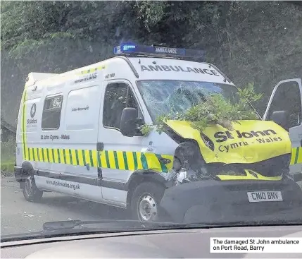  ??  ?? The damaged St John ambulance on Port Road, Barry