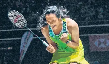 ?? AFP ?? PV Sindhu celebrates her victory against China’s Wang Zhi Yi in their women’s final at the Singapore Open on Sunday.