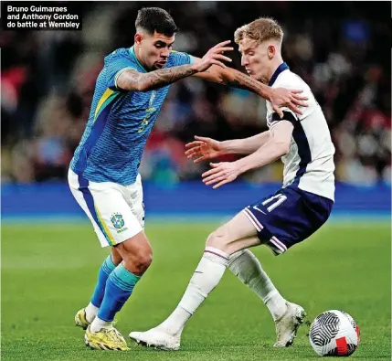  ?? ?? Bruno Guimaraes and Anthony Gordon do battle at Wembley