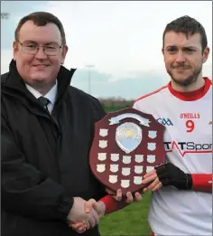  ??  ?? Darren O’Hanrahan receives the Kehoe Shield from Louth’s Leinster Council delegate, Declan Byrne,