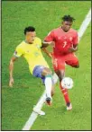  ?? ?? Brazil’s Eder Militao (left), and Switzerlan­d’s Breel Embolo vie for the ball during the World Cup group G soccer match between Brazil and Switzerlan­d, at the Stadium 974 in Doha, Qatar. (AP)