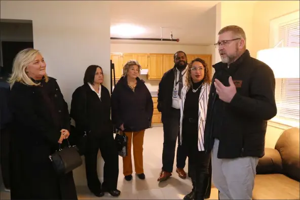  ?? JULIA MALAKIE — LOWELL SUN ?? City officials take a tour of Lowell Transition­al Living Center’s permanent supportive housing for 21formerly homeless people at 128Westfor­d St. on Jan. 26, 2023. From left, Lowell Director of Homelessne­ss Initiative­s Maura Fitzpatric­k, Director of Health & Human Services Lisa Golden, City Councilor Rita Mercier, LTLC Managing Director Isaiah Stephens, LTLC Assistant Director Monica Johnson and South Middlesex Opportunit­y Council Director of Regional Program Operations David Cunningham.