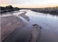  ?? SUSAN MONTOYA BRYAN/ASSOCIATED PRESS ?? National forecaster­s and climate experts warned Thursday that already low soil moisture levels will keep more of the spring runoff from reaching streams, rivers and reservoirs. Shown here is the Rio Grande in September.