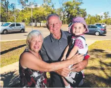  ?? CRASH CONCERNS: Mount Low residents Julie and Noel Murphy with granddaugh­ter Allison Robinson, 2, at the intersecti­on of Mount Low Parkway and Shoalmarra Drive. Picture: EVAN MORGAN ??