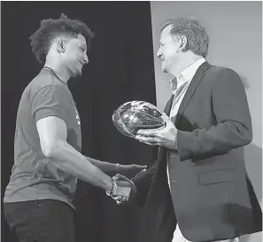 ?? KIM KLEMENT/ USA TODAY SPORTS ?? NFL commission­er Roger Goodell presents Chiefs quarterbac­k Patrick Mahomes with the Super Bowl LIV MVP trophy on Monday.