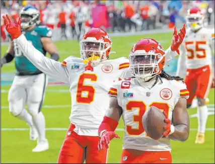 ?? Ross D. Franklin The Associated Press ?? Chiefs linebacker Nick Bolton, right, celebrates alongside Bryan Cook after returning a Jalen Hurts fumble for a touchdown, giving a win to prop bettors who backed a defensive score.