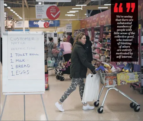  ?? PICTURE: GARETH COPLEY/GETTY IMAGES ?? SUPERMARKE­T SWEEP: A board displays shopping restrictio­ns at a store to prevent shelves being cleared by panic buying.