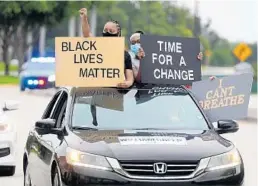  ?? MIKE STOCKER/SOUTH FLORIDA SUN SENTINEL ?? A demonstrat­or holds an “I Can’t Breathe” sign during a protest in Broward County.