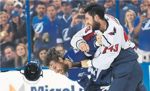  ?? JONATHAN NEWTON THE WASHINGTON POST/GETTY IMAGES ?? The Caps’ Tom Wilson, landing a punch on Tampa’s Braydon Coburn, is playing a more skilled game since his fourth suspension in little more than a full NHL season.