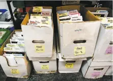  ??  ?? Boxes are filled with files for monthly bookclub subscriber­s at Comix Experience. The book club has increased revenue.