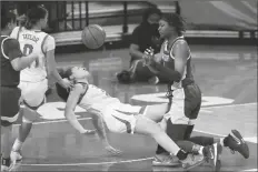  ?? ASSOCIATED PRESS ?? BAYLOR FORWARD NALYSSA SMITH (right) collides with Texas guard Audrey Warren (31) as she drives to the basket during the first half of a game on Monday in Austin, Texas.