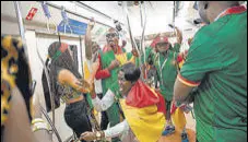  ?? AFP ?? Cameroon fans inside the metro in Doha.