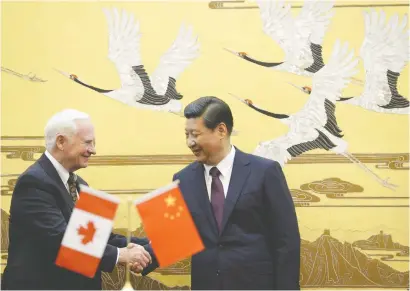  ?? KOTA ENDOKOTA ENDO/AFP/GETTY IMAGES ?? Canada's former governor general David Johnston shakes hands with Chinese President Xi Jinping in 2013. Despite all of the Trudeau government's talk about progress with China, nothing is being done, says Terry Glavin.
