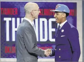  ?? KATHY WILLENS / ASSOCIATED PRESS ?? Lausanne alumnus Cameron Payne (with NBA Commission­er Adam Silver) is eager to get going with Oklahoma City. “I’m excited, man. I’m ready to get on the court,” the No. 14 overall pick said.