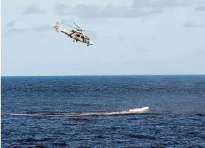  ??  ?? Sea chase: A file photo of a French Navy Panther helicopter tailing a boat carrying suspected Somali pirates. — AFP