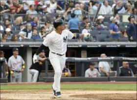  ?? BILL KOSTROUN — THE ASSOCIATED PRESS ?? New York Yankees’ Gleyber Torres follows through on a two-run home run during the fifth inning of a baseball game against the Detroit Tigers, Saturday at Yankee Stadium in New York.