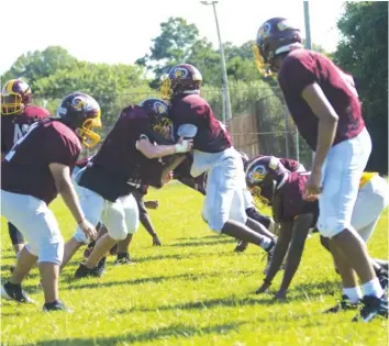  ?? STAFF PHOTO BY TROY STOLT ?? Tyner Academy linemen perform a drill during practice on Monday.