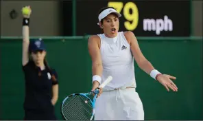 ?? AP/BEN CURTIS ?? Garbine Muguruza of Spain gestures Thursday after losing a point to Alison Van Uytvanck of Belgium at Wimbledon. The third-seeded Muguruza went on to lose the match in three sets.