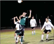  ?? Buy these photos at YumaSun.com PHOTOS BY WARNER STRAUSBAUG­H/YUMA SUN ?? LEFT: GILA RIDGE’S ESTEBAN FRANCO (10) scores on a penalty kick in the fourth minute Friday against San Luis at Veterans Memorial Stadium. ABOVE: Gila Ridge’s Erick Beltran (left) and San Luis’ Erik Vera go up for a header during the first half during...