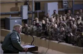  ?? ANDREW HARNIK — THE ASSOCIATED PRESS ?? President Donald Trump speaks to U.S. troops at al-Asad Airbase in Iraq on Wednesday.