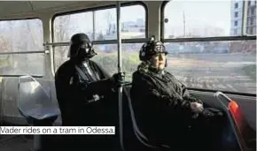  ??  ?? Vader rides on a tram in Odessa.