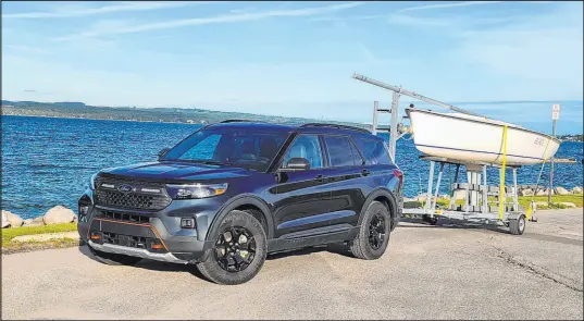  ?? Henry Payne The Detroit News ?? Its 250-mile journey complete, the Ford Explorer Timberline arrives at Lake Charlevoix with its boat cargo intact.