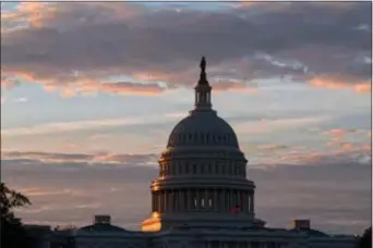  ?? AP PHOTO — J. SCOTT APPLEWHITE ?? In this file photo, the U.S. Capitol in Washington at sunrise.