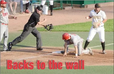  ?? NEWS PHOTO SEAN ROONEY ?? Jackson Hooge of the Medicine Hat Mavericks is called out at third base as Edmonton Prospects fielder Anthony Cusati hangs on to the ball after making the tag Wednesday at Re/Max Field in Edmonton.