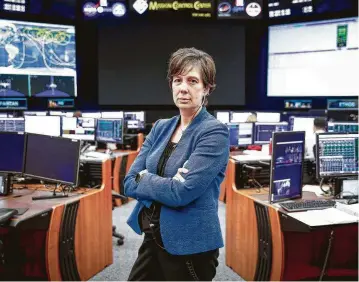  ?? Michael Ciaglo / Staff photograph­er ?? NASA Chief Flight Director Holly Ridings, the first woman to hold the post, works at Mission Control in the Johnson Space Center. “My attitude is, ‘OK, let’s fix that and let’s make it better,’ ” she says.