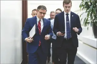  ?? J. SCOTT APPLEWHITE/AP ?? HOUSE SPEAKER MIKE JOHNSON, R-LA. (LEFT) arrives for a closed-door meeting with fellow Republican­s at the Capitol in Washington on Monday.