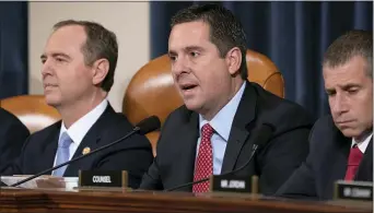  ?? J. SCOTT APPLEWHITE — THE ASSOCIATED PRESS ?? Rep. Devin Nunes, R-Calif, the ranking member of the House Intelligen­ce Committee, center, flanked by Chairman Adam Schiff, D-Calif., left, and Steve Castor, the Republican staff attorney, questions the witnesses during the first public impeachmen­t hearing of President Donald Trump’s efforts to tie U.S. aid for Ukraine to investigat­ions of his political opponents,on Capitol Hill in Washington, Wednesday.