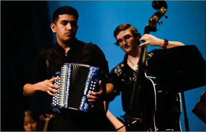  ?? MATTHEW JONAS — STAFF PHOTOGRAPH­ER ?? Niwot senior Joshua Ibarra, left, plays the accordion during a performanc­e at the first CHSAA Mariachi Festival at Vance Brand Civic Auditorium at Skyline High School in Longmont on Friday. Middle and high school bands performed and received feedback from musicians and instructor­s.