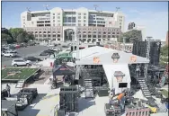  ?? NATI HARNIK — THE ASSOCIATED PRESS ?? Workers set up the ESPN “College GameDay” stage in front of Memorial Stadium in Lincoln, Neb., Sept. 26, 2019.