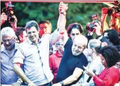  ?? AFP ?? Luiz Inacio Lula da Silva (centre right) and Fernando Haddad (centre left) take part in a demonstrat­ion on January 24 in Sao Paulo.