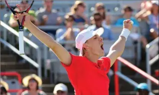  ?? PAUL CHIASSON, THE CANADIAN PRESS ?? Canada’s Denis Shapovalov celebrates after beating Rogerio Dutra Silva of Brazil at the Rogers Cup on Tuesday.