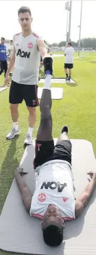  ??  ?? Paul Pogba and Diogo Dalot during training in Dubai yesterday