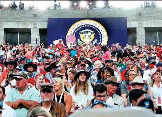  ?? TOM BRENNER / REUTERS ?? Attendees wait for US President Donald Trump to speak at the Independen­ce Day celebratio­ns at Mount Rushmore in Keystone, South Dakota, on Saturday.