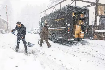  ?? Robert Gauthier Los Angeles Times ?? SAEED FARDIN clears a sidewalk in February in Big Bear. This weekend’s storm should bring significan­t snowfall to the Southern California mountains and the southern Sierra, adding to the year’s impressive totals.