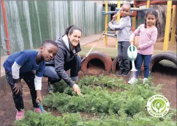  ??  ?? Young, enthusiast­ic gardeners Wandile Ndlela, 6, Okuhle Sibaya, 5, and Gabriela Yon, 6, with their Grade R teacher Jolene Pote working on the carrot patch at their Mother Goose Preschool.