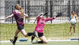  ?? statesman.com. RICARDO B. BRAZZIELL / AMERICAN-STATESMAN ?? Round Rock’s Hanna Banks scores against Coppell’s Lauren Kellett in a Class 6A, Region II semifinal Friday at Reeves Athletic Complex. The Dragons won 1-0. See more photos with this story at