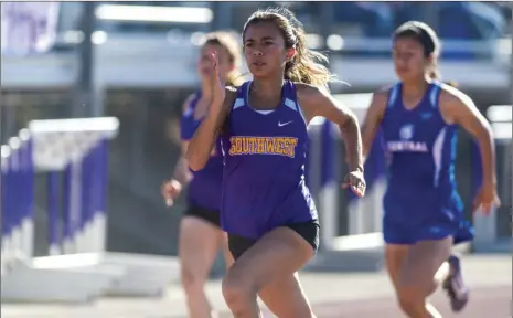  ?? VINCENT OSUNA PHOTO ?? Southwest High’s Skye Silva sprints in the girls’ 100-meter dash event during their home track-and-field meet against Central Union High on Thursday in El Centro. Silva won the girls’ 100m in 13.30 seconds and the 200m in 27.32 seconds.