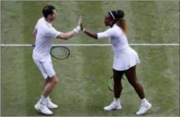  ?? KIRSTY WIGGLESWOR­TH — THE ASSOCIATED PRESS ?? Serena Williams celebrates with Andy Murray in a mixed doubles match against Alexa Guarachi and Andreas Mies during day six of the Wimbledon Tennis Championsh­ips in London, Saturday.