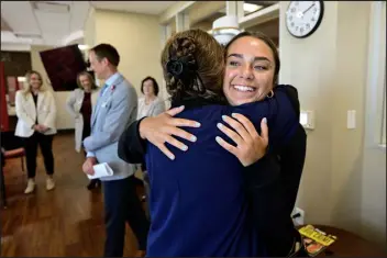  ?? PHOTOS BY MATTHEW JONAS — DAILY CAMERA ?? Former patient and University of Colorado student Nicole Briar, right, hugs nurse practition­er Debbie Petersen in the rehabilita­tion unit at Uchealth Broomfield.