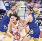  ?? Ricardo B. Brazziell / Associated Press ?? Syracuse guard Tiana Mangakahia (4) is fouled by South Dakota State’s Lindsey Theuninck (3) and Tylee Irwin (21) during Sunday’s NCAA Tournament game in Austin.