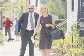  ?? Kevin Wolf / Associated Press ?? Departing Homeland Security Secretary Kirstjen Nielsen is seen on Monday outside her home in Alexandria, Va.