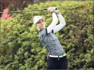  ?? Steve Dykes / Getty Images ?? Sophia Popov of Germany hits her tee shot on the first hole during the first round of the Cambia Portland Classic at Columbia Edgewater Country Club on Sept. 18 in Portland, Ore.